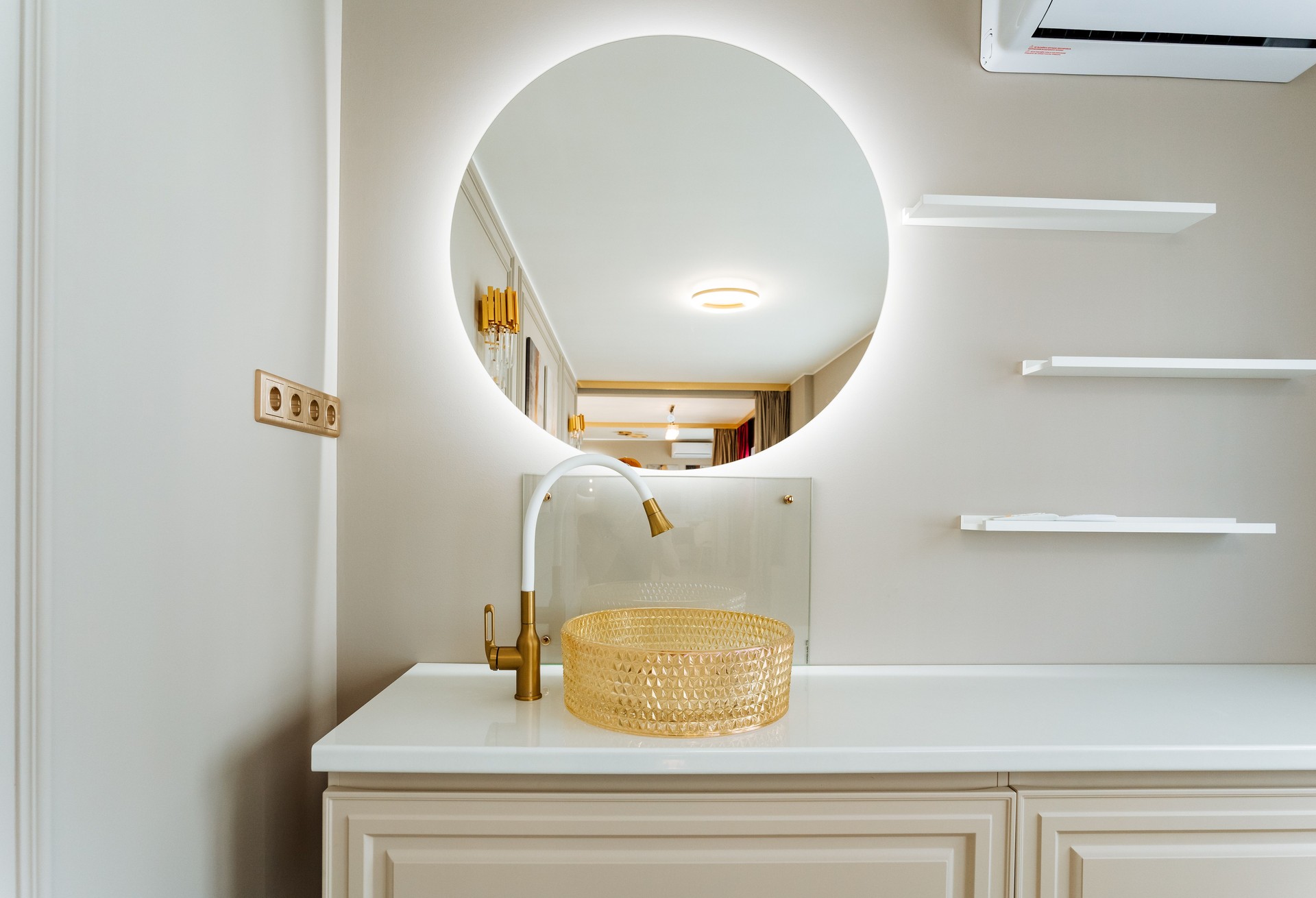 For a modern and elegant bathroom, incorporate an illuminated mirror, upscale lighting, and stylish vanity into your design for a sophisticated and contemporary appearance